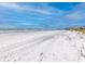 Beautiful beach with a view of the ocean and beachfront properties at 12000 4Th St E, Treasure Island, FL 33706