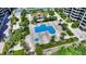 Aerial view of the community pool and lush landscaping at 1211 Gulf Of Mexico Dr # 207, Longboat Key, FL 34228