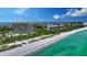Aerial shot of the building, beach and ocean at 1211 Gulf Of Mexico Dr # 207, Longboat Key, FL 34228