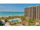 High-rise building on the beach with a view of the ocean at 1211 Gulf Of Mexico Dr # 207, Longboat Key, FL 34228