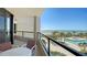 Beautiful condo balcony featuring seating and overlooking a swimming pool and the ocean at 1211 Gulf Of Mexico Dr # 207, Longboat Key, FL 34228