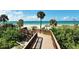 Wooden boardwalk provides direct access to the sandy beach at 1211 Gulf Of Mexico Dr # 207, Longboat Key, FL 34228