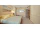 Cozy bedroom with serene decor and ample natural light at 1211 Gulf Of Mexico Dr # 207, Longboat Key, FL 34228