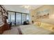 Bedroom featuring a serene view, ample desk space and a large window for natural light at 1211 Gulf Of Mexico Dr # 207, Longboat Key, FL 34228