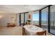 Dining room with access to balcony and beautiful water views at 1211 Gulf Of Mexico Dr # 207, Longboat Key, FL 34228