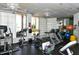 Bright fitness center featuring a variety of exercise equipment and large windows at 1211 Gulf Of Mexico Dr # 207, Longboat Key, FL 34228