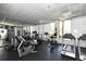 Well-equipped gym with modern cardio machines, weights, and ample natural light at 1211 Gulf Of Mexico Dr # 207, Longboat Key, FL 34228