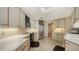 Functional kitchen with tile floors and ample counter space at 1211 Gulf Of Mexico Dr # 207, Longboat Key, FL 34228