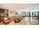 Spacious living room with tile flooring, neutral decor, and plenty of natural light at 1211 Gulf Of Mexico Dr # 207, Longboat Key, FL 34228