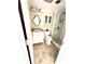 Bathroom with a vanity, mirror, toilet, and a glass-enclosed walk-in shower at 1250 N Portofino Dr # 408Mar, Sarasota, FL 34242