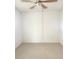 The bedroom features a ceiling fan and neutral carpeting at 1250 N Portofino Dr # 408Mar, Sarasota, FL 34242