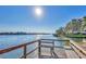 Relaxing dock area with benches offers stunning waterfront views, perfect for enjoying the scenery at 1250 N Portofino Dr # 408Mar, Sarasota, FL 34242