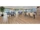 Community meeting room features vinyl plank floors and space for tables and chairs at 1250 N Portofino Dr # 408Mar, Sarasota, FL 34242