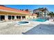 Community pool with heated spa and ample lounge seating at 1250 N Portofino Dr # 408Mar, Sarasota, FL 34242