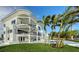 A modern multi-story home with waterfront views, balconies, and a backyard pool and hot tub at 1400 Siesta Dr, Sarasota, FL 34239