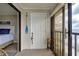Balcony door with nautical decorations leading to room with bed at 14459 River Beach Dr # 218, Port Charlotte, FL 33953