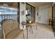 Balcony with seating, side table, and slider door leading inside at 14459 River Beach Dr # 218, Port Charlotte, FL 33953