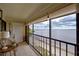 Relaxing balcony area with a table and chairs offers beautiful water views at 14459 River Beach Dr # 218, Port Charlotte, FL 33953