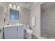 Bathroom features contemporary fixtures, a walk-in shower with elegant tile, and ample lighting for a pleasant experience at 14459 River Beach Dr # 218, Port Charlotte, FL 33953