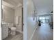 Well-lit bathroom with contemporary fixtures, walk-in shower, and neutral tones, offering a clean and relaxing experience at 14459 River Beach Dr # 218, Port Charlotte, FL 33953