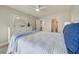Inviting bedroom with bright coastal decor, ceiling fan, and ensuite bathroom access at 14459 River Beach Dr # 218, Port Charlotte, FL 33953