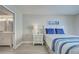 Comfortable bedroom featuring neutral walls, light wood floors, and serene coastal accents at 14459 River Beach Dr # 218, Port Charlotte, FL 33953