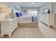 Beautifully decorated bedroom with a slider that leads to a balcony at 14459 River Beach Dr # 218, Port Charlotte, FL 33953