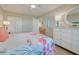 Cozy bedroom offers ample closet space, neutral colors, and beach-themed decor for a comfortable and serene retreat at 14459 River Beach Dr # 218, Port Charlotte, FL 33953