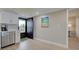 Kitchen area near doorway with stainless steel dishwasher and modern décor at 14459 River Beach Dr # 218, Port Charlotte, FL 33953