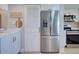 Modern kitchen features stainless steel appliances, ample cabinet space, and a nearby pantry for convenient storage at 14459 River Beach Dr # 218, Port Charlotte, FL 33953