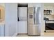 Kitchen showcases modern appliances, and a washer and dryer hidden behind stylish doors for added convenience at 14459 River Beach Dr # 218, Port Charlotte, FL 33953