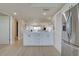 Bright kitchen with center island, sleek appliances, and wood-look flooring at 14459 River Beach Dr # 218, Port Charlotte, FL 33953