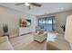 Bright living room with a flat-screen TV, access to a balcony, and comfortable seating at 14459 River Beach Dr # 218, Port Charlotte, FL 33953