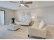 Comfortable living room with neutral tones, modern furniture, and bright lighting at 14459 River Beach Dr # 218, Port Charlotte, FL 33953