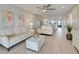 Open living area with modern decor, neutral colors, and an open floor plan connecting to the kitchen at 14459 River Beach Dr # 218, Port Charlotte, FL 33953