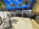 Outdoor patio with a shaded dining area, ideal for entertaining guests at 14459 River Beach Dr # 218, Port Charlotte, FL 33953