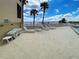 Spacious pool deck with lounge chairs overlooking the water at 14459 River Beach Dr # 218, Port Charlotte, FL 33953