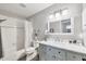 Clean bathroom with shower-tub, light gray walls, and a vanity with a marble countertop at 1709 Curry Trl # 30, North Venice, FL 34275