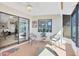 Cozy lanai featuring tile flooring, comfortable seating, and sliding glass door access to the main room at 1709 Curry Trl # 30, Nokomis, FL 34275