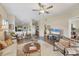 Spacious living area featuring hardwood floors, comfortable seating, and an open floor plan at 1709 Curry Trl # 30, Nokomis, FL 34275