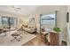 Comfortable living room with stylish furnishings, a ceiling fan, and access to a screened patio at 1709 Curry Trl # 30, Nokomis, FL 34275