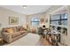 Home office with a comfortable sofa, lots of natural light, and built-in shelving at 1709 Curry Trl # 30, Nokomis, FL 34275