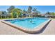 Inviting community pool with clear blue water perfect for swimming laps or relaxing with friends at 1709 Curry Trl # 30, Nokomis, FL 34275