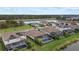 Aerial view of a residential community featuring pools, lakes, and well-manicured lawns at 17610 Polo Trl, Bradenton, FL 34211