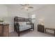 Bright bedroom with a wooden bunk bed, neutral carpet and a large window at 17610 Polo Trl, Bradenton, FL 34211