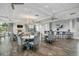 Elegant clubhouse featuring tables, chairs, a bar, and a cozy fireplace for community gatherings at 17610 Polo Trl, Bradenton, FL 34211