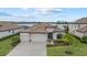 Beautiful single Gathering home with lush lawn, two car garage, and well-maintained landscaping at 17610 Polo Trl, Bradenton, FL 34211