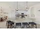 Modern kitchen with granite counters, barstool seating, and stainless steel appliances at 17610 Polo Trl, Bradenton, FL 34211