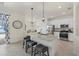Bright kitchen features granite countertops, stainless appliances, and a breakfast bar with seating at 17610 Polo Trl, Bradenton, FL 34211