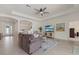 Comfortable living room with tile floors, stylish decor, and lots of natural light at 17610 Polo Trl, Bradenton, FL 34211